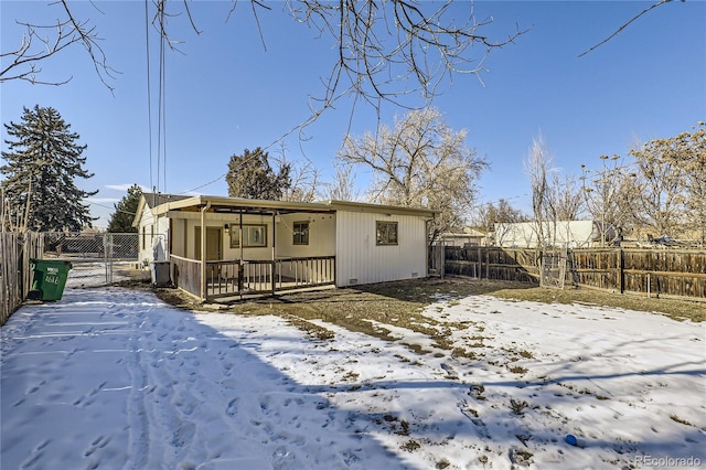 view of snow covered house