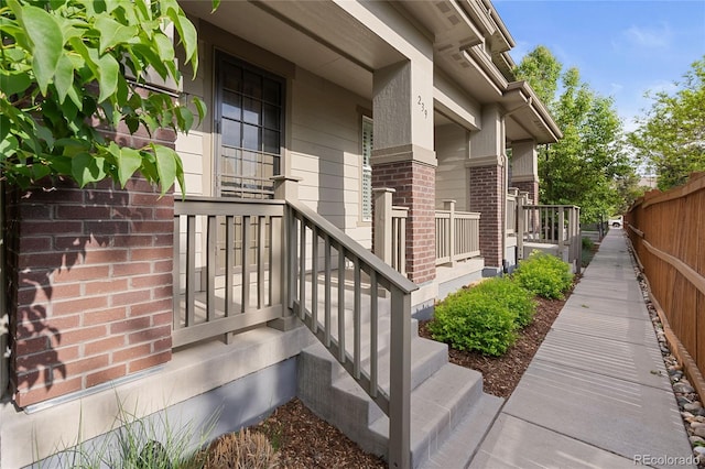 239 W Jamison Ct, Littleton, CO 80120 - view of exterior entry featuring brick siding