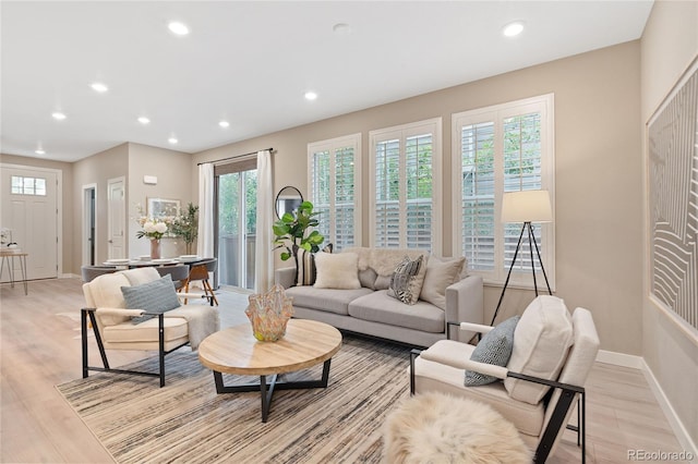 239 W Jamison Ct, Littleton, CO 80120 - living room featuring recessed lighting, light wood-style flooring, and baseboards