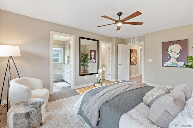 239 W Jamison Ct, Littleton, CO 80120 - carpeted bedroom featuring baseboards, ensuite bath, and a ceiling fan
