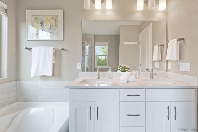 239 W Jamison Ct, Littleton, CO 80120 - bathroom featuring a stall shower, double vanity, and a garden tub