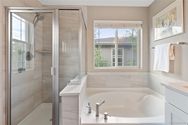 239 W Jamison Ct, Littleton, CO 80120 - bathroom with a garden tub, a shower stall, and vanity