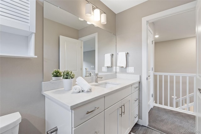 239 W Jamison Ct, Littleton, CO 80120 - bathroom featuring vanity and toilet