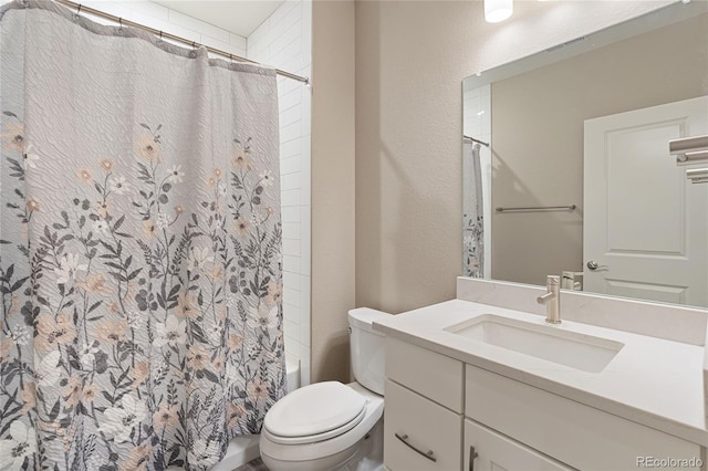 239 W Jamison Ct, Littleton, CO 80120 - bathroom featuring vanity, toilet, shower / bath combination with curtain, and a textured wall