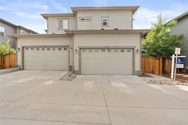 239 W Jamison Ct, Littleton, CO 80120 - view of front facade with concrete driveway and an attached garage