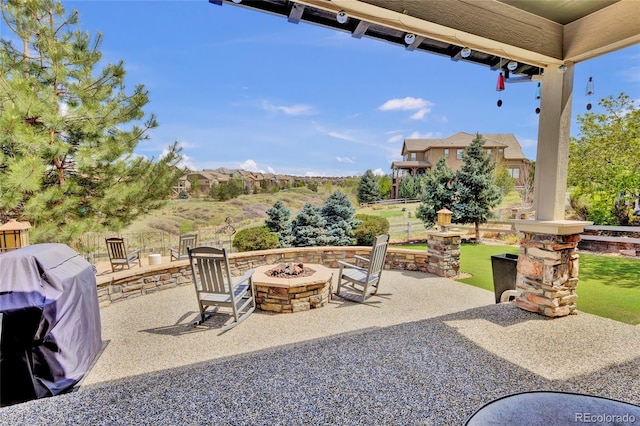 view of patio featuring grilling area and a fire pit