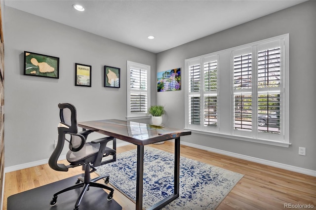 office space featuring baseboards, recessed lighting, and wood finished floors
