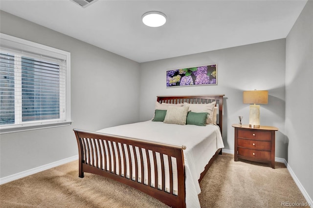 carpeted bedroom with baseboards