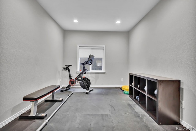 exercise room featuring recessed lighting and baseboards