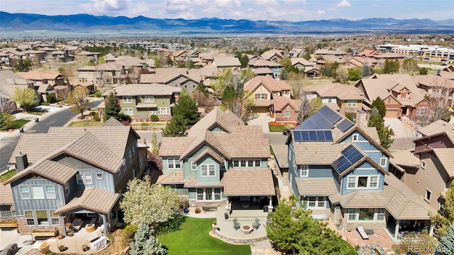 birds eye view of property with a mountain view and a residential view