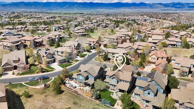 drone / aerial view with a residential view and a mountain view
