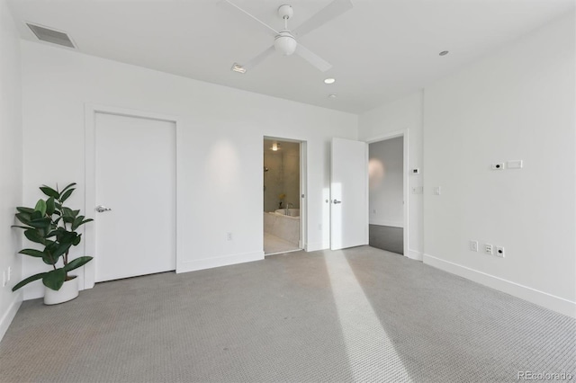 unfurnished bedroom with ceiling fan and ensuite bathroom