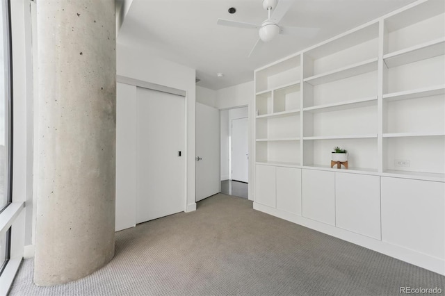 unfurnished bedroom with light colored carpet and ceiling fan