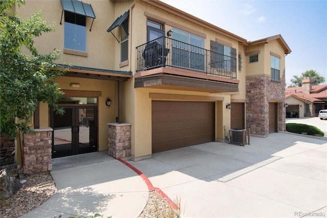 view of front of property featuring cooling unit and french doors