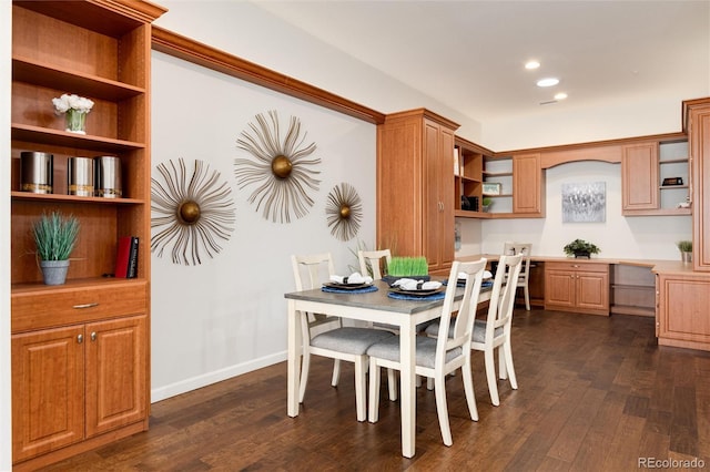 dining space featuring dark hardwood / wood-style floors and built in desk