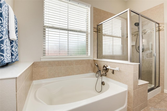 bathroom with tile patterned flooring and plus walk in shower