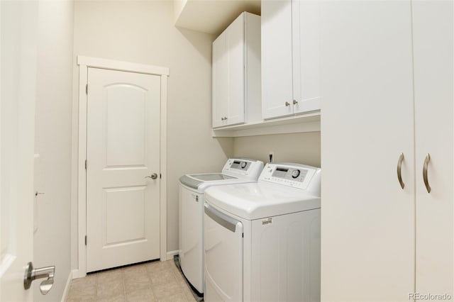 laundry area with cabinets and washer and dryer