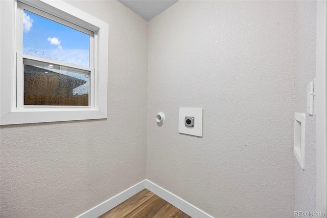 851 S Eliot St, Denver, CO 80219 - laundry area featuring hookup for an electric dryer, baseboards, and wood finished floors