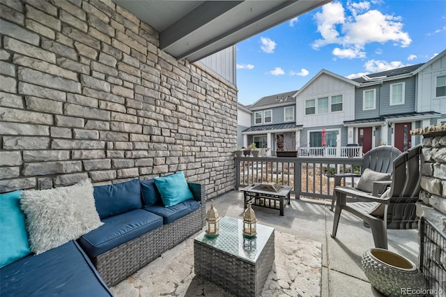 view of patio / terrace with a residential view and outdoor lounge area