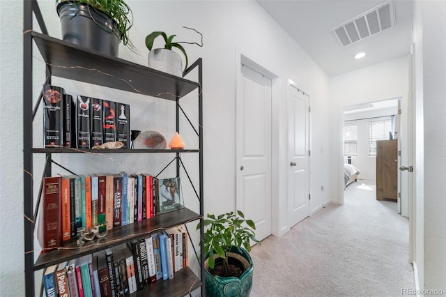 corridor featuring recessed lighting, baseboards, visible vents, and carpet flooring