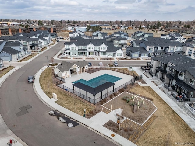 birds eye view of property with a residential view