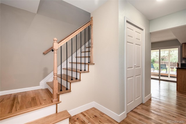 8666 E Easter Ave, Centennial, CO 80112 - staircase with wood finished floors and baseboards