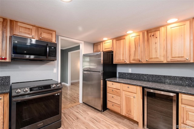 8666 E Easter Ave, Centennial, CO 80112 - kitchen with stainless steel appliances, wine cooler, light brown cabinetry, light wood-type flooring, and baseboards