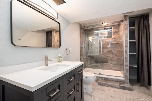 8666 E Easter Ave, Centennial, CO 80112 - full bathroom with vanity, toilet, a stall shower, and marble look tile flooring