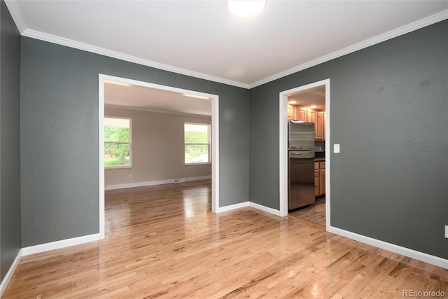 8666 E Easter Ave, Centennial, CO 80112 - empty room featuring light wood-type flooring, ornamental molding, and baseboards