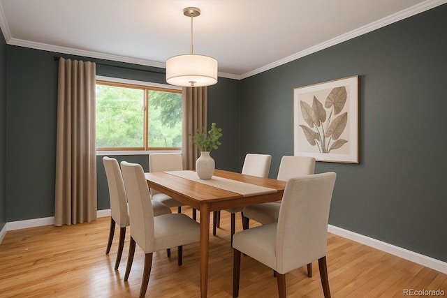 8666 E Easter Ave, Centennial, CO 80112 - dining space featuring ornamental molding, baseboards, and light wood-type flooring