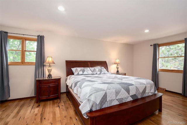 8666 E Easter Ave, Centennial, CO 80112 - bedroom featuring light wood-style flooring, recessed lighting, and baseboards