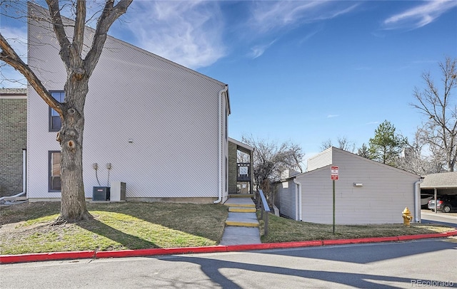 view of property exterior featuring a yard and cooling unit