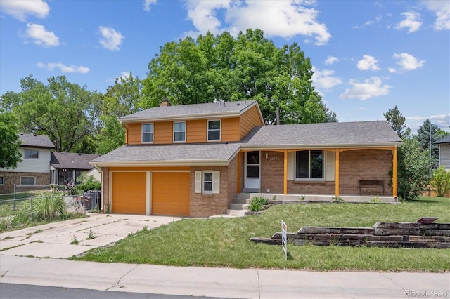 3625 E 128th Pl, Thornton, CO 80241 - view of front facade featuring brick siding, an attached garage, driveway, and a chimney