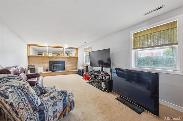 3625 E 128th Pl, Thornton, CO 80241 - living room featuring a fireplace, carpet floors, and plenty of natural light