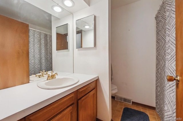 3625 E 128th Pl, Thornton, CO 80241 - bathroom featuring vanity, toilet, and tile patterned floors