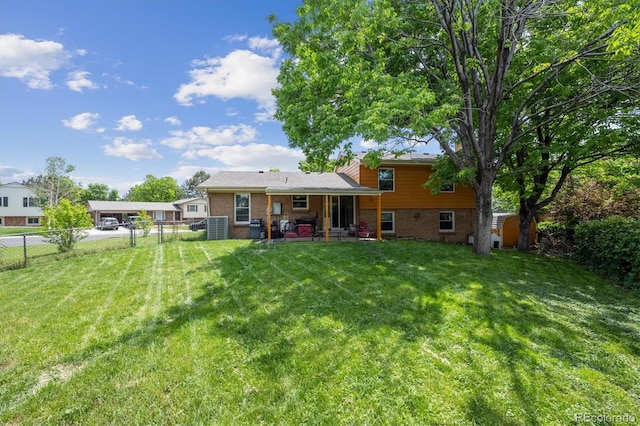 3625 E 128th Pl, Thornton, CO 80241 - rear view of house with brick siding, central AC unit, and a patio area
