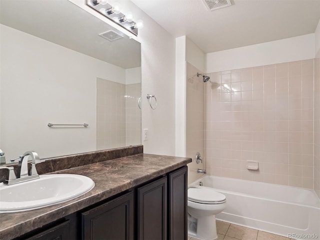 full bathroom featuring tile patterned flooring, visible vents, toilet, and vanity