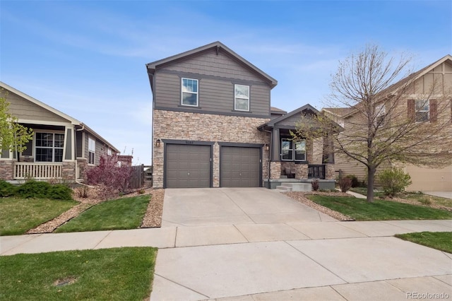 view of front of house with a garage, a front lawn, driveway, and stone siding