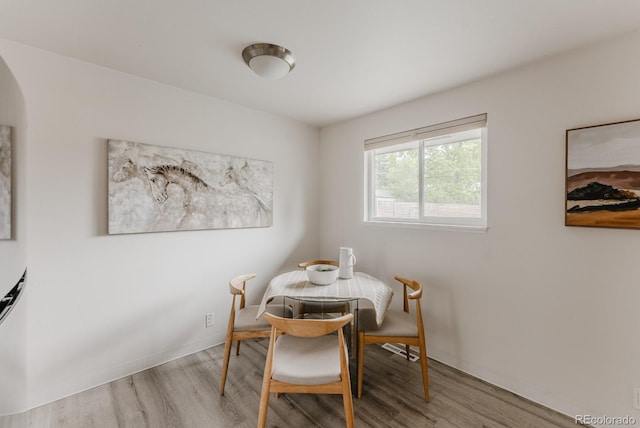 755 34th St, Boulder, CO 80303 - dining space featuring wood finished floors and arched walkways