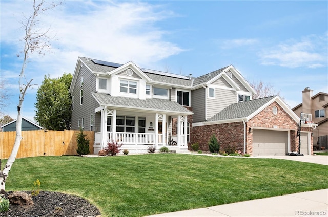 view of front of house featuring fence, an attached garage, a porch, roof mounted solar panels, and driveway