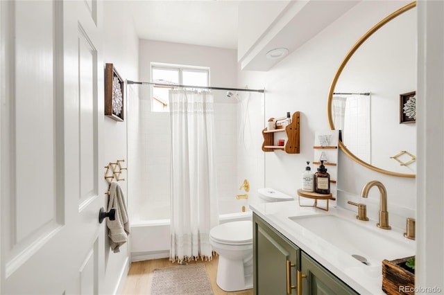 full bath with vanity, toilet, wood finished floors, and shower / tub combo with curtain