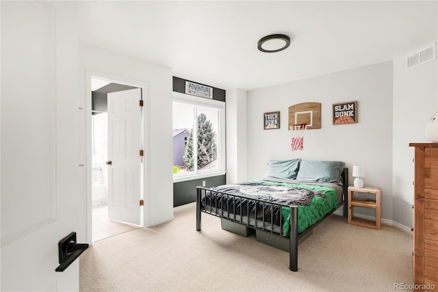 bedroom with carpet floors, baseboards, and visible vents