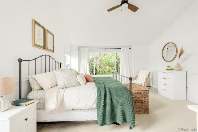 carpeted bedroom featuring ceiling fan and lofted ceiling