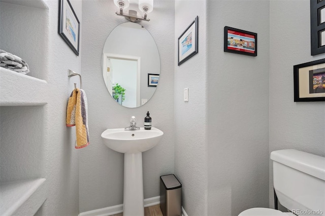 bathroom with toilet and sink