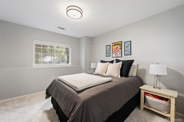 carpeted bedroom with baseboards