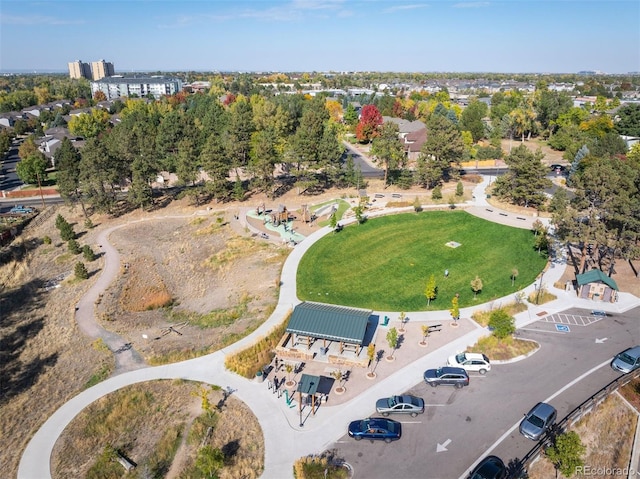 aerial view of property and surrounding area featuring a park
