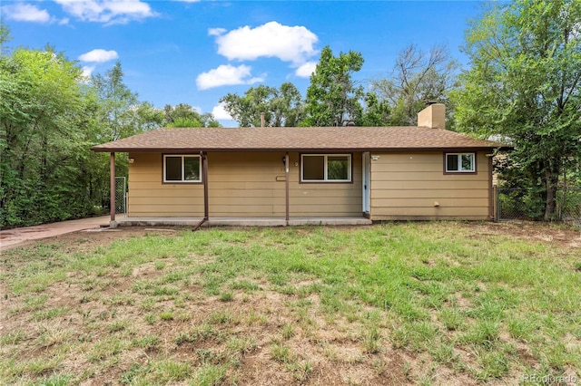 134 Hayes Dr, Colorado Springs, CO 80911 - view of front of house featuring a chimney