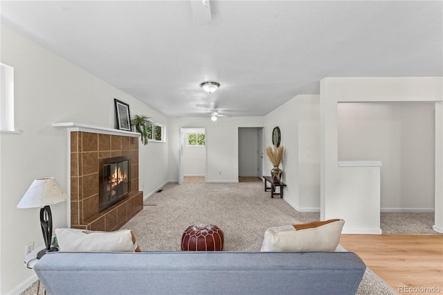 134 Hayes Dr, Colorado Springs, CO 80911 - living room featuring a tile fireplace and a ceiling fan