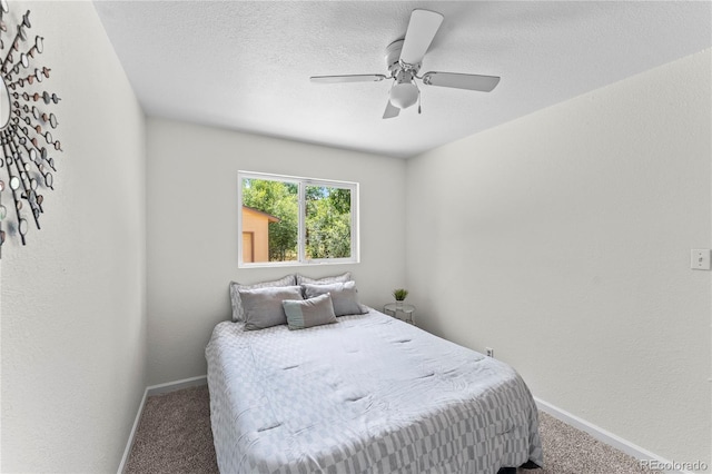 134 Hayes Dr, Colorado Springs, CO 80911 - bedroom with carpet flooring, a ceiling fan, and a textured ceiling