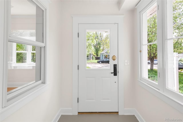 539 Baker St, Longmont, CO 80501 - doorway to outside featuring baseboards